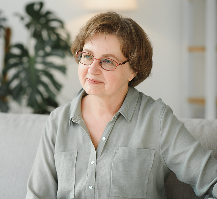 Senior woman patient looking optimistic at the doctor's office