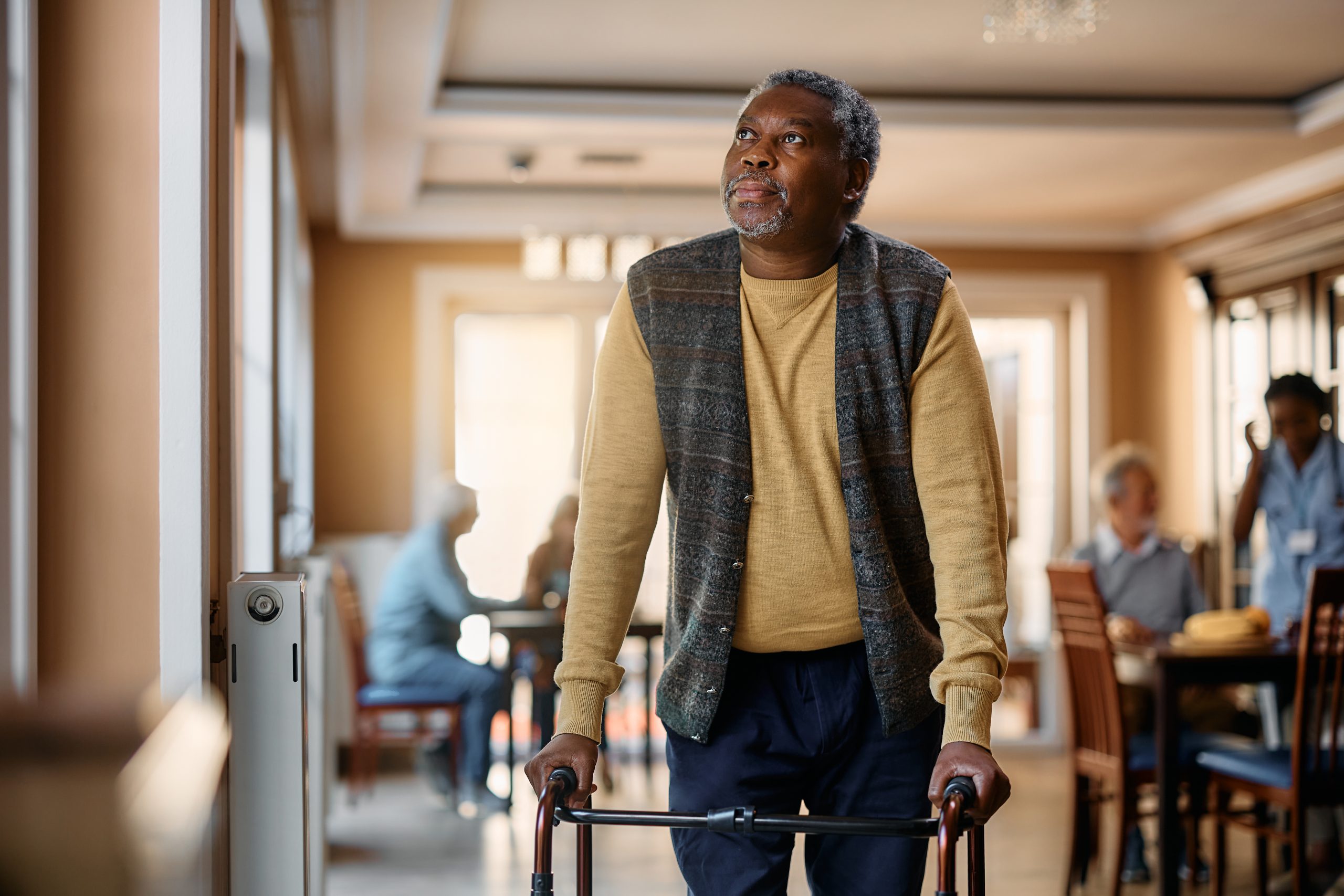 Black senior man with walker