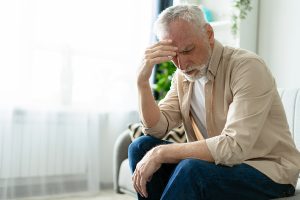 Man suffering dizziness after standing up