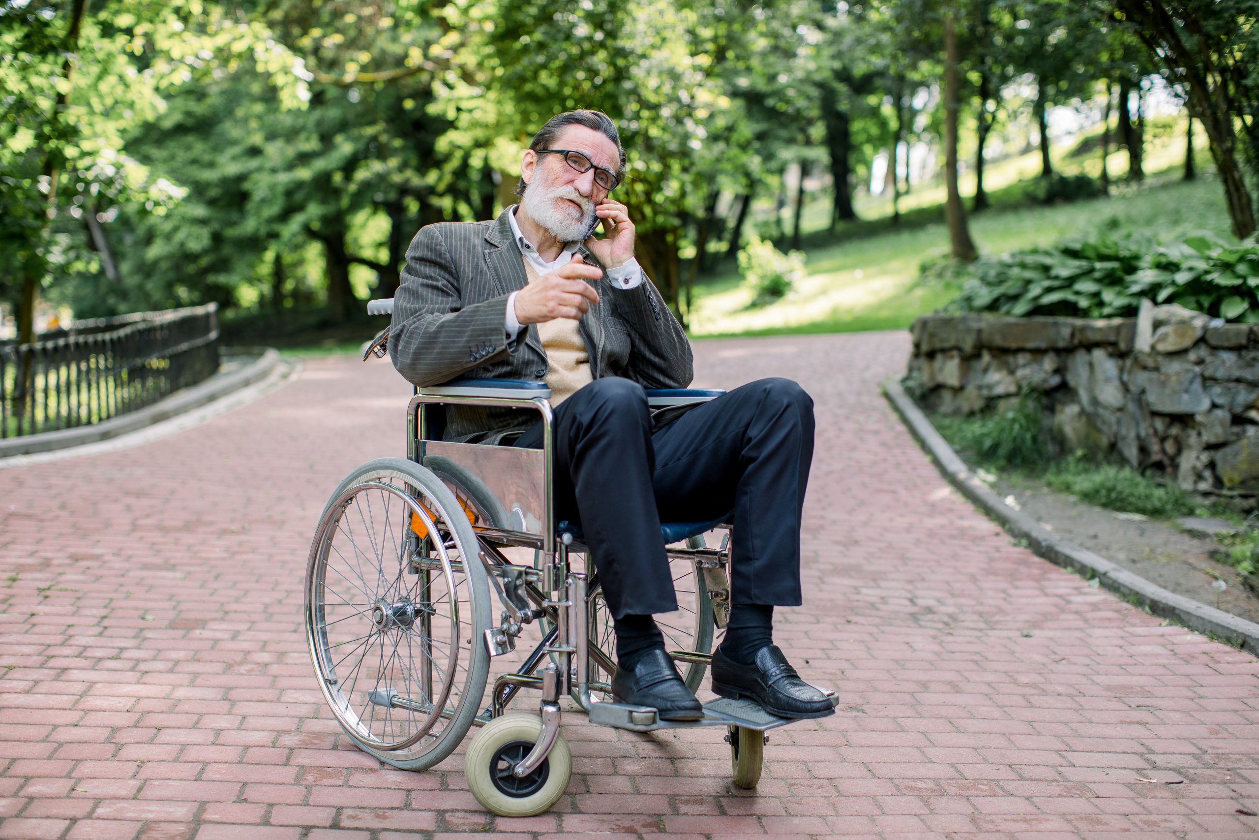 White bearded man in a wheelchair