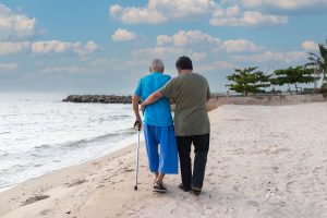 Person assisting another person with walking due to balance problems.