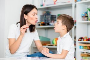 Child with speech therapist