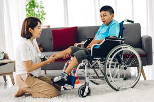 Boy with Duchenne in a wheelchair