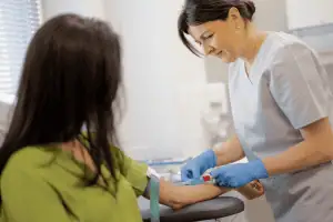Healthcare professional performing a blood test