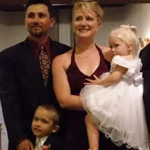 Photo of a young couple and their 2 children 